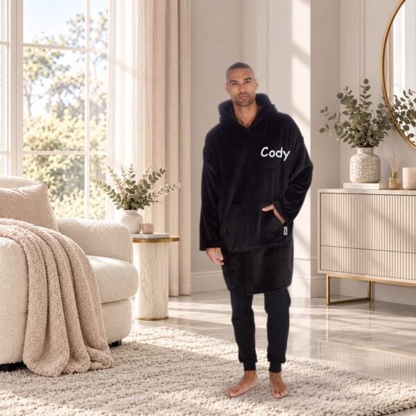 Personalised adult oversized sherpa hoodie in Black embroidered with the name Cody