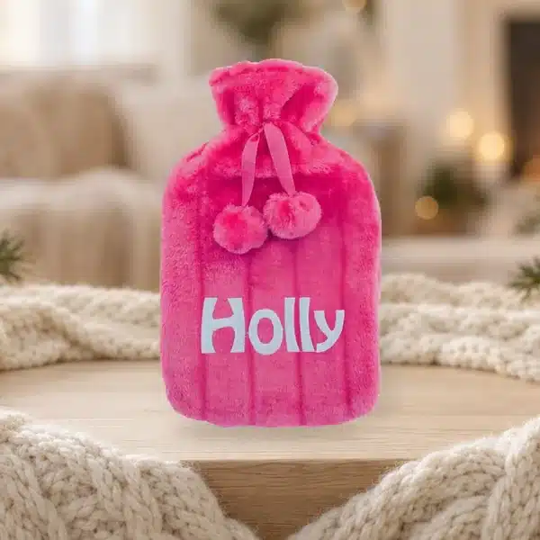 Pink personalised hot water bottle embroidered with the name Holly