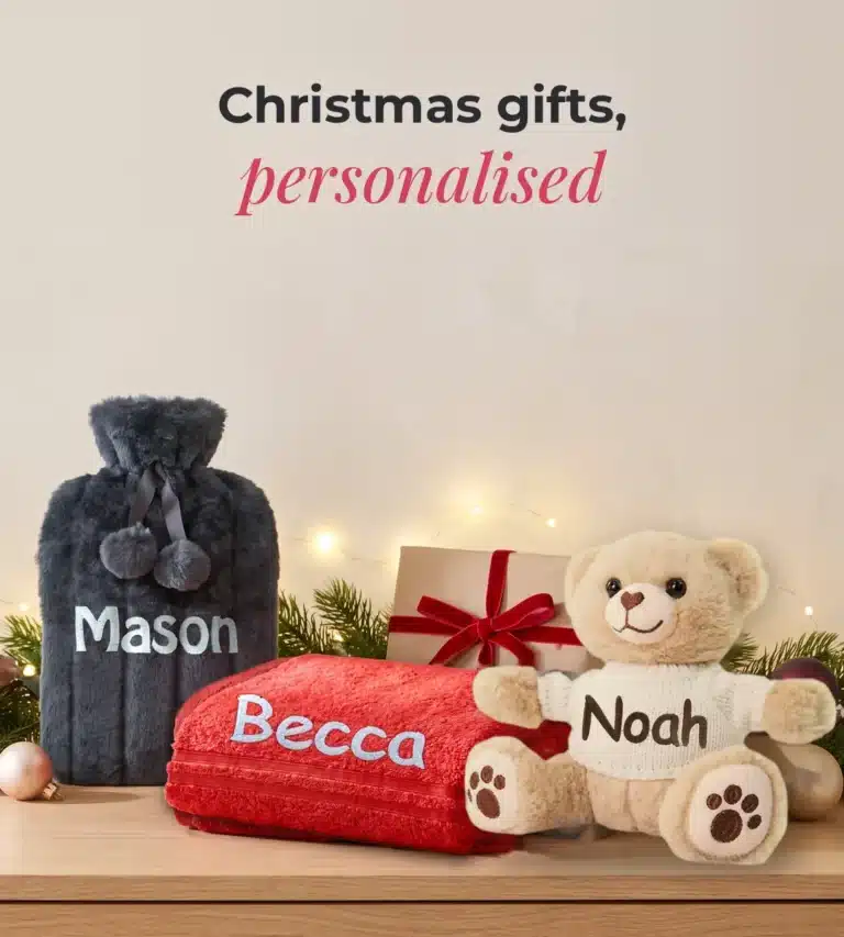Personalised Christmas gifts embroidered with names: hot water bottle, red towel and teddy