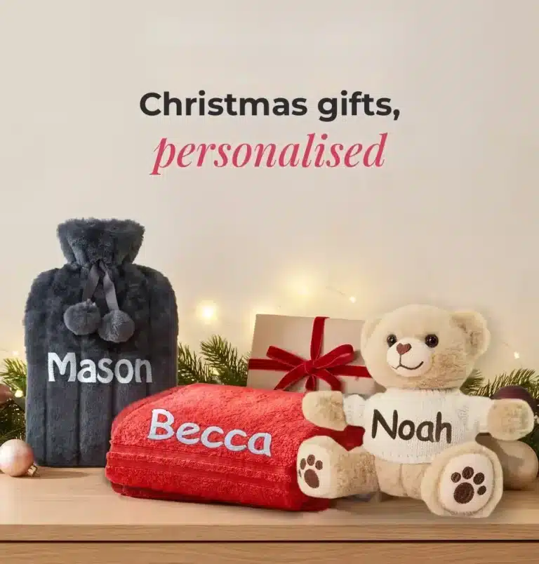 Personalised Christmas gifts embroidered with names: hot water bottle, red towel and teddy