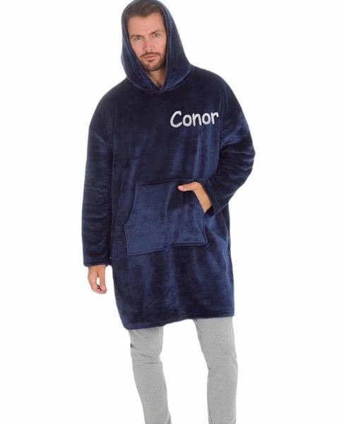 Man wearing a navy personalised oversized hoodie embroidered with Conor
