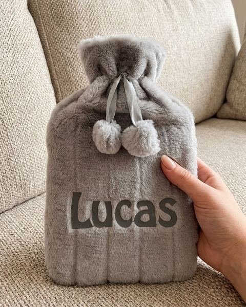 Personalised fluffy hot water bottle cover with an embroidered name