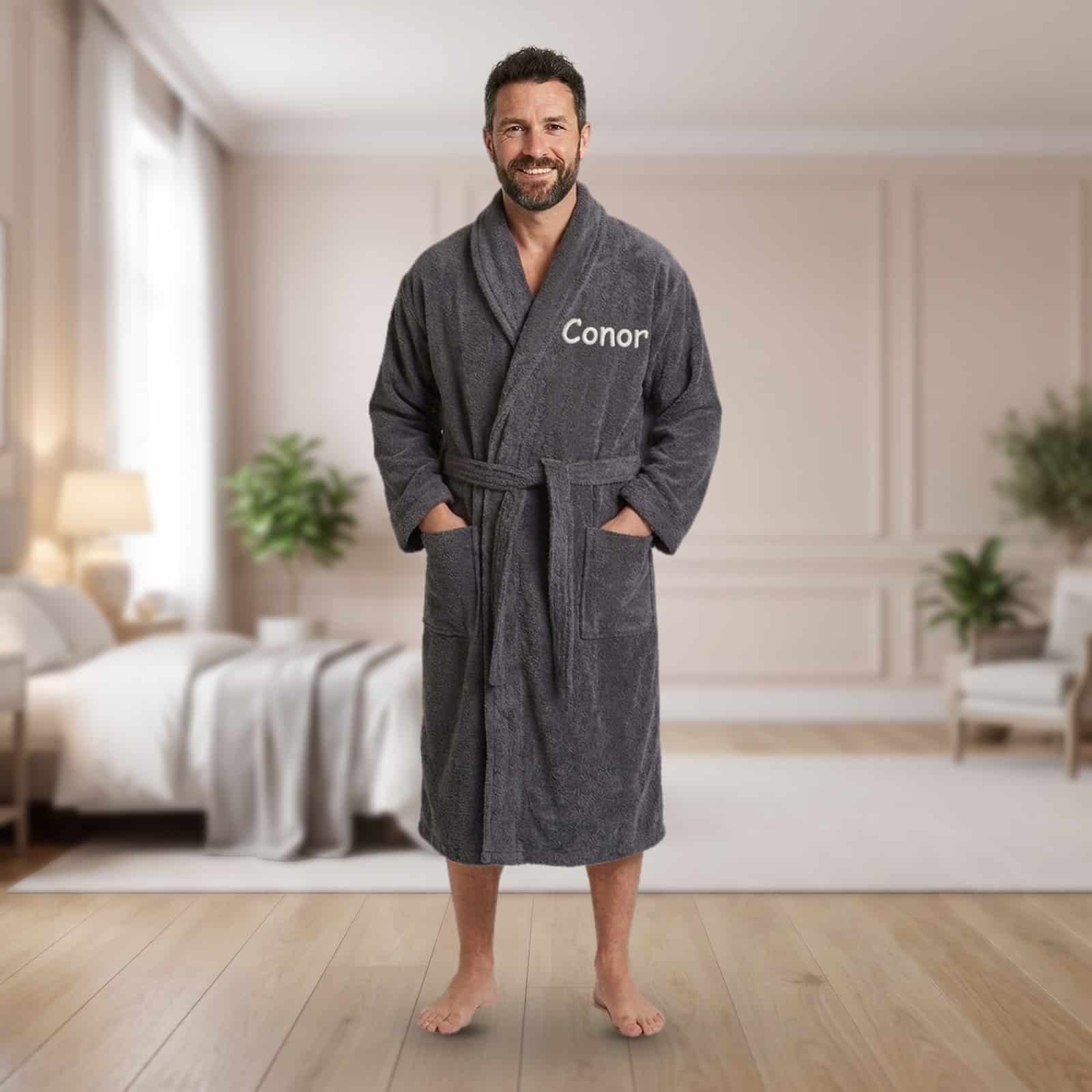 Personalised grey adult towelling robe with a shawl collar and a name embroidered on the chest