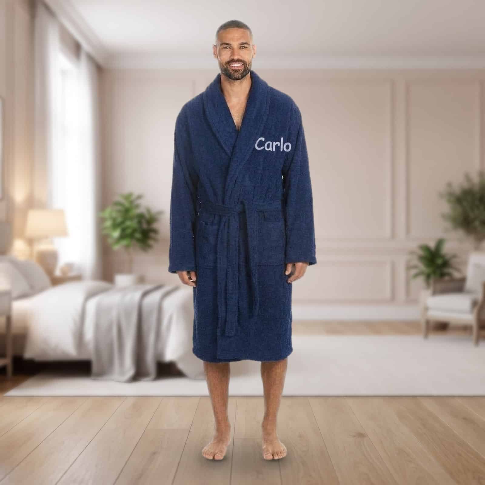 Personalised navy adult towelling robe with a shawl collar and a name embroidered on the chest